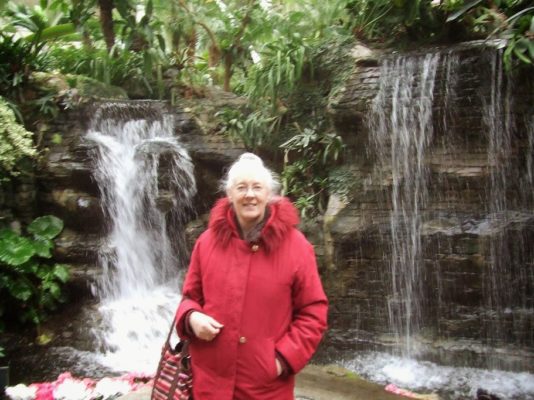 Me in my red coat in the atrium of the Opryland Hotel.